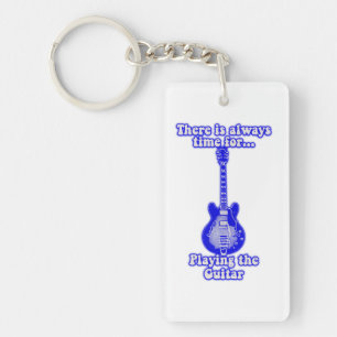 There is always time for playing the guitar. blue key ring