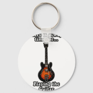 There is always time for playing the guitar. retro key ring