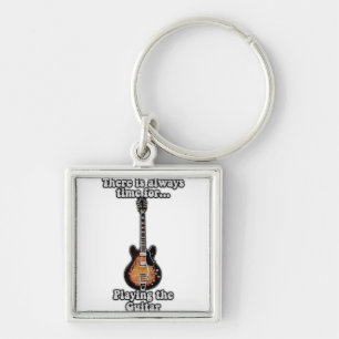There is always time for playing the guitar. retro key ring