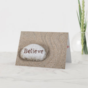 thinking of you-word Believe on rock in beach sand Card
