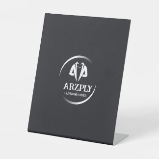 This is white and grey cloth store logo. pedestal sign
