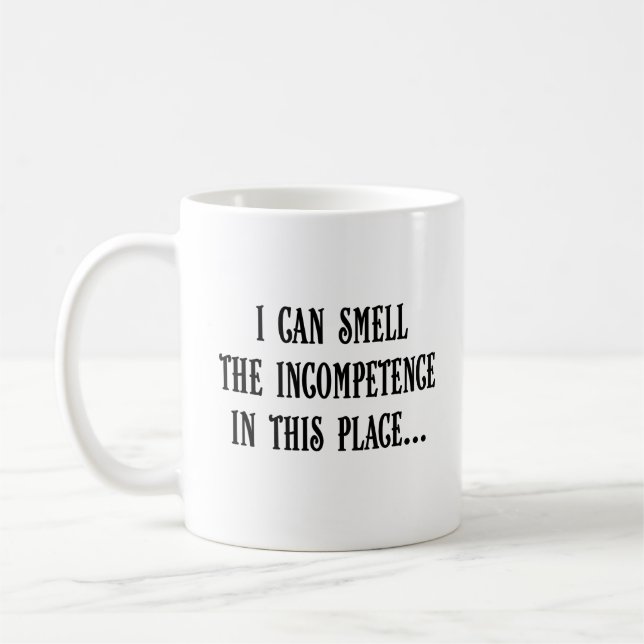 This place reeks of incompetence (2) coffee mug (Left)