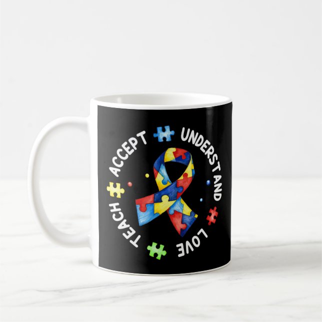 This tee with autism puzzle slogan "Teach Accept U Coffee Mug (Left)