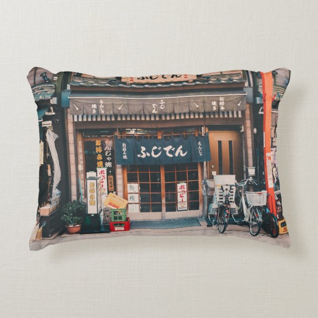 THREE BICYCLES PARKED IN FRONT OF BUILDING DECORATIVE CUSHION (Front)