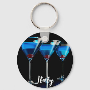 Three blue cocktails with cherry on black key ring