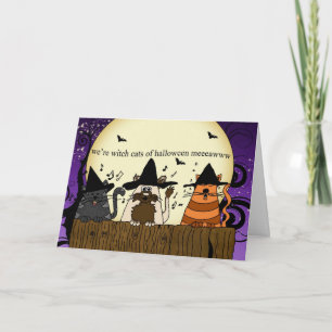 three cats on a fence singing for halloween , hall card
