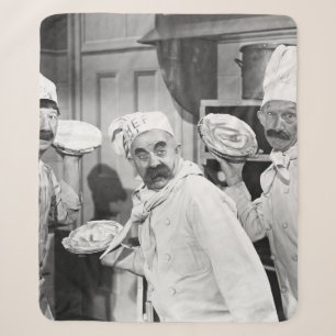Three chefs holding pies for a fight in the kitche sherpa blanket