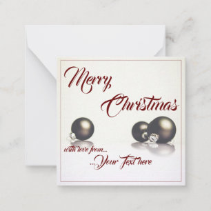 Three christmas balls in front of light background card