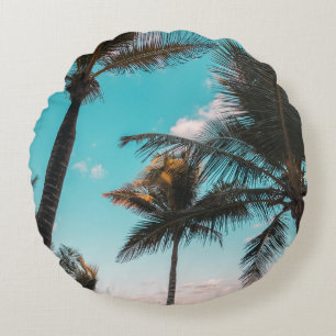 Three coconut trees on seashore round cushion