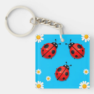 Three Colourful Ladybugs on Blue Background Key Ring