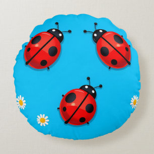 Three Colourful Ladybugs on Blue Background Round Cushion