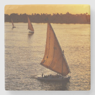 Three falukas with sightseers on Nile River at Stone Coaster