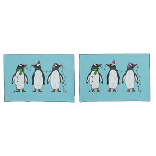 Three Festive Christmas Penguins On Light Blue Pillowcase