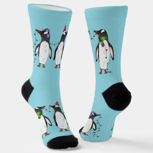 Three Festive Christmas Penguins On Light Blue Socks