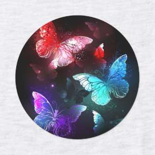 Three Glowing Butterflies on night background