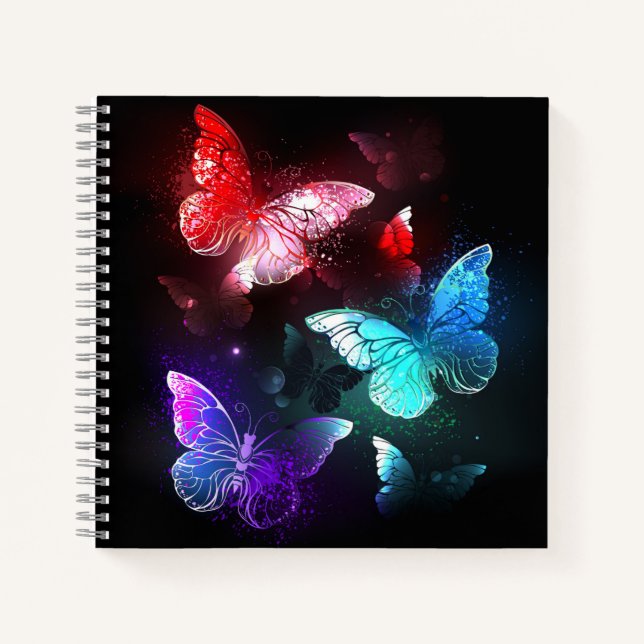 Three Glowing Butterflies on night background Notebook (Front)