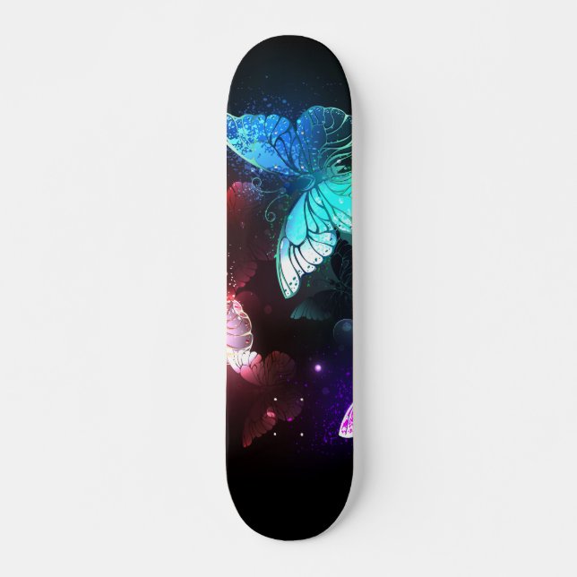 Three Glowing Butterflies on night background Skateboard (Front)