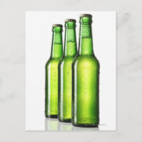 Three green bottles of beer on white background,