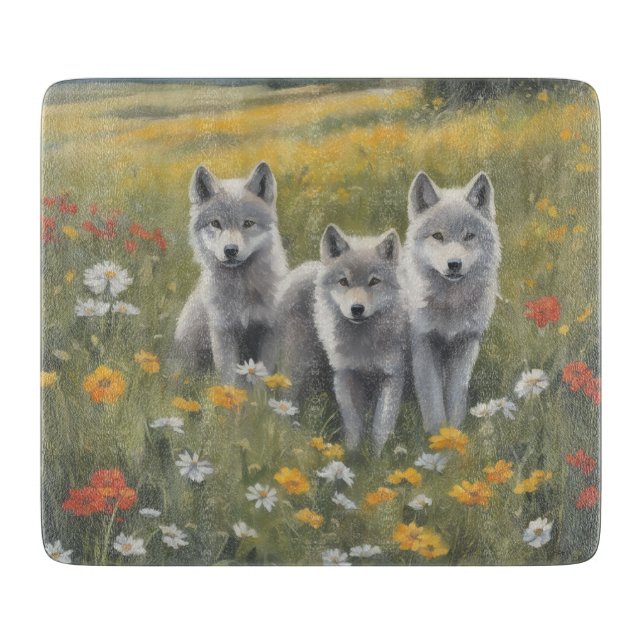 Three grey wolf pups waiting and watching cutting board (Front)