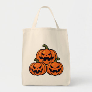 Three jack o'lantern pumpkins tote bag