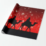 THREE KINGS ON RED SKY WITH STARS WRAPPING PAPER<br><div class="desc">On this image you see the black silhouettes of the three Kings,  or three Wise Men,  on their way on Christmas night,  riding on camels. On the background,  a red sky with a gradient to darker red,  filled with white glowing stars in various sizes.</div>