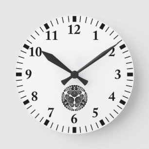 Three paulownia blooms, heads facing outward round clock