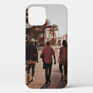 Three persons walking near palm trees iPhone 12 case