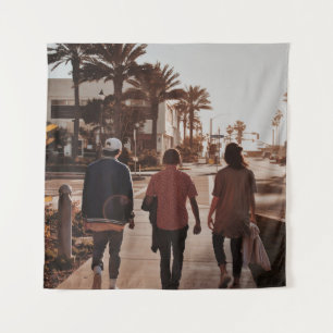 Three persons walking near palm trees tapestry