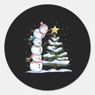 Three Snowmen Are Arranging A Christmas Tree Cute  Classic Round Sticker