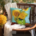Three Sunflowers | Vincent van Gogh Cushion<br><div class="desc">Three Sunflowers (1888) by Vincent van Gogh is a vibrant still life that showcases the artist’s signature thick brushstrokes and bold use of colour. The painting features three sunflowers in a simple vase, their golden petals contrasting against the aqua blue background. Van Gogh's vivid yellow palette brings energy and life...</div>