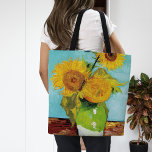 Three Sunflowers | Vincent Van Gogh Tote Bag<br><div class="desc">Three Sunflowers (1888) by Dutch artist Vincent Van Gogh. Original fine art painting is an oil on canvas depicting a still life of bright yellow sunflowers against a turquoise background. 

Use the design tools to add custom text or personalise the image.</div>