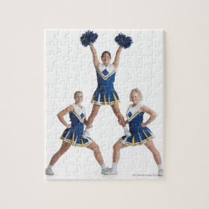 three teenage caucasian female cheerleaders in jigsaw puzzle