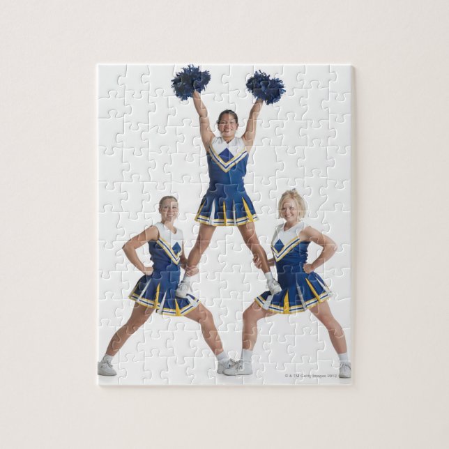 three teenage caucasian female cheerleaders in jigsaw puzzle (Vertical)