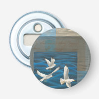Three White Seagulls Flying Over the Water