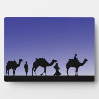 Three Wise Men on their journey riding camels