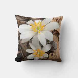 Throw pillow with white wildflower