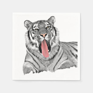 Tiger lying in snow and showing tongue napkin