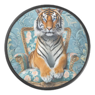 Tiger sitting on a vintage chair hockey puck