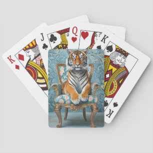 Tiger sitting on a vintage chair playing cards