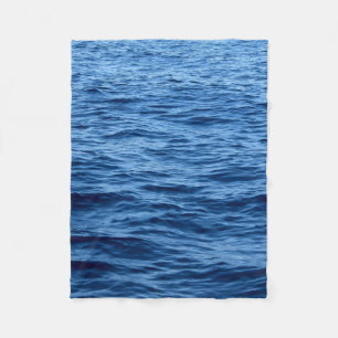 Time lapse photography of body of water fleece blanket