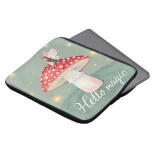 Tiny fairy perched on top of mushroom and glowing laptop sleeve