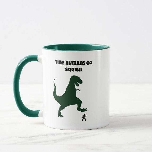 Tiny Humans Go Squish Funny Dinosaur Cartoon Mug (Left)
