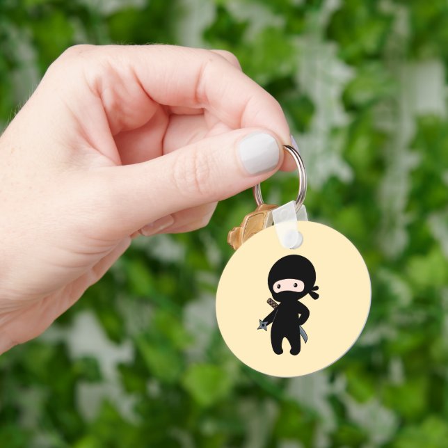 Tiny Ninja Holding Throwing Star on Yellow Key Ring (Hand)