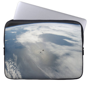 Tiny Satellites Orbit Above A Part Of Earth. Laptop Sleeve