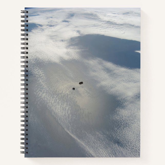 Tiny Satellites Orbit Above A Part Of Earth. Notebook (Front)