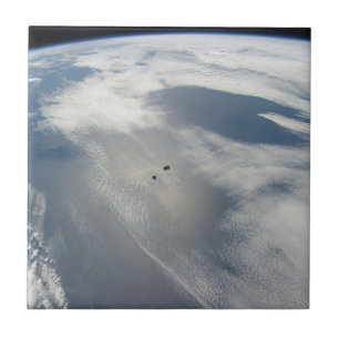 Tiny Satellites Orbit Above A Part Of Earth. Tile