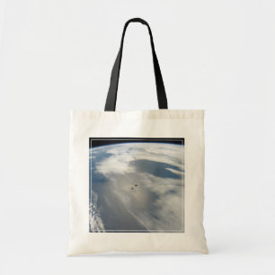 Tiny Satellites Orbit Above A Part Of Earth. Tote Bag