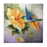 Tiny Wings Tile<br><div class="desc">A beautiful blue Hummingbird on an Orange Hibiscus Flower.
Original Art by Morag Bates.</div>