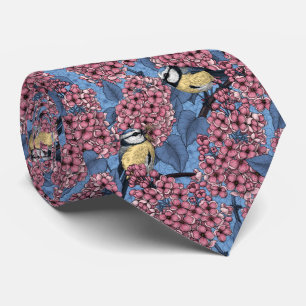Tit birds in the lilac garden tie