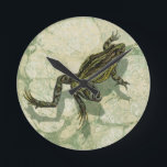 Toad Swinning in the Water Round Clock<br><div class="desc">Vision Studio is using the giclée (French for “to spray”) technique in this art piece. It makes it unique and the different shades of green emphasise the peacefulness on this image. Choose this piece of artwork for your next Zazzle product.</div>